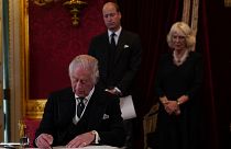 King Charles III signs an oath to uphold the security of the Church in Scotland during the Accession Council at St James's Palace.