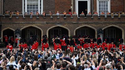 Members of the public listen to the proclamation following the Accession Council ceremony at St James's Palace. 