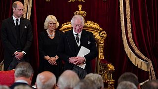 Charles III accompanied by Queen Consort and Prince of Wales at proclamation ceremony