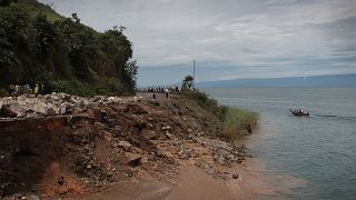Rising lake waters consume Congolese homes, roads