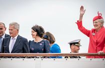 Danish Queen Margrethe, together with guests, waves on departure with the Royal Yacht Dannebrog in Copenhagen.