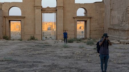 Tourists visit the ancient city of Hatra in northern Iraq on September 10, 2022