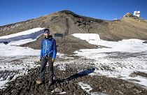 Glaciologist Mauro Fischer stands at the newly uncovered path between the Scex-Rouge and the Zanfleuron Glaciers.