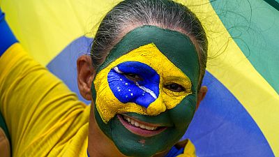A supporter of Brazil's President Jair Bolsonaro attends a military parade commemorating the bicentennial of the country's independence in Brasilia, Brazil, 7 Sept., 2022.