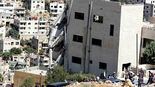 انهيار جانب أحد المباني غربي العاصمة الأردنية عمان، الأحد 12 آب / أغسطس 2018