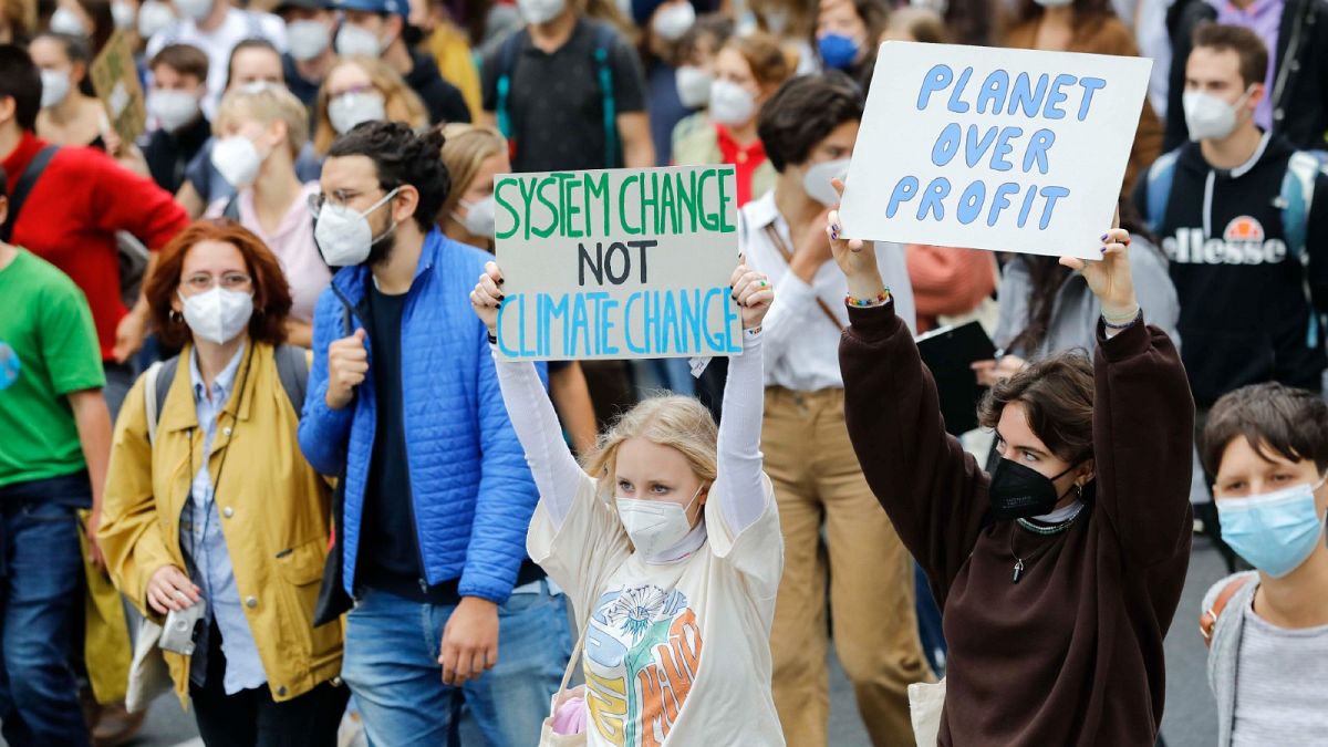 Students march as part of the Fridays for Future climate movement's initiatives in Vienna, Austria, Friday, Sept. 24, 2021