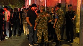 Relatives of servicemen wounded in border clashes gather outside a military hospital in Armenia on September 13, 2022.