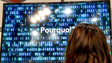 A technician works on a protective cybersecurity system on January 22, 2019 in Lille, during the 11th International Cybersecurity Forum. 