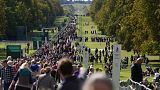 People make their way along the Long Walk towards Cambridge gate outside Windsor Castle to lay flowers for the late Queen Elizabeth II in Windsor, England, Saturday, Sept. 17,