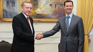  الرئيس التركي رجب طيب أردوغان ونظيره السوري بشار الأسد