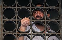 Abed Soubra, who is allegedly holding hostages in a bank in an effort to get to funds in his account, speaks with media in Beirut, Lebanon.
