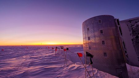 The Sun dawns over the NOAA facilities in the South Pole where a hole in the ozone layer opens up every year.