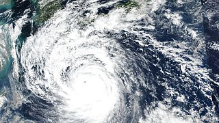 This Saturday, Sept. 17, 2022 satellite image released by NASA shows Typhoon Nanmadol, which is approaching southwest Japan.