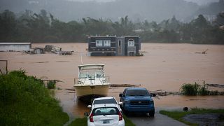 Una casa está sumergida en las aguas causadas por el huracán Fiona en Cayey, Puerto Rico, el domingo 18 de septiembre de 2022.