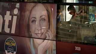 A poster of Italy's candidate premier Giorgia Meloni stands on the side of a bus in Rome, Friday, 16 September 2022.
