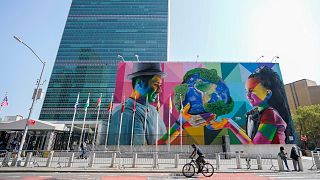 A mural by Brazilian artist Eduardo Kobra, focusing attention on climate change is displayed outside the United Nations headquarters in New York.