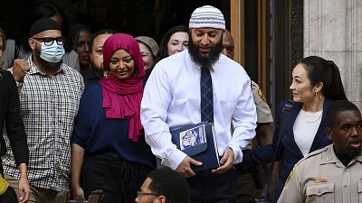 Adnan Syed, center right, leaves the courthouse after the hearing, Monday, Sept. 19, 2022