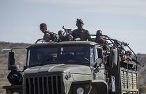 Ethiopian government soldiers ride in the back of a truck on a road near Agula, north of Mekele, in the Tigray region of northern Ethiopia. 8 May 2021.