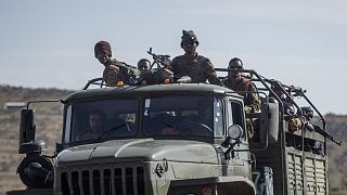 Ethiopian government soldiers ride in the back of a truck on a road near Agula, north of Mekele, in the Tigray region of northern Ethiopia. 8 May 2021.