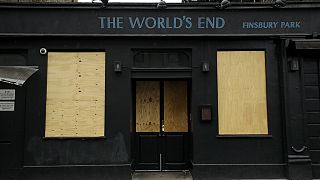 The World's End pub, which is a traditional place name for a boundary or the edge of an urban area, stands temporarily closed with boarded up windows due to Covid, 2020.