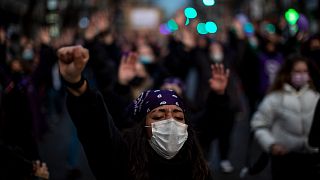 A woman takes part in a demonstration, on International Women's Day in Madrid, Spain, Monday, March 8, 2021. 