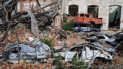 Destroyed cars are seen, as Russia's attack on Ukraine continues, in the town of Izium, recently liberated by Ukrainian Armed Forces, in Kharkiv region, Ukraine