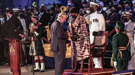 Barbados' new President Sandra Mason, center right, awards Prince Charles with the Order of Freedom of Barbados during the presidential inauguration ceremony.