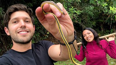 Scientists Alejandro Arteaga and Amanda Quezada with one of the newly named snakes.