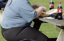 A person eats in London on 17 October 2007
