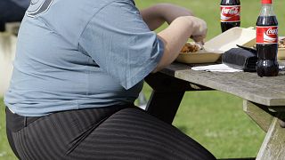 A person eats in London on 17 October 2007