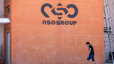 A logo adorns a wall on a branch of the Israeli NSO Group company, near the southern Israeli town of Sapir, Aug. 24, 2021. 