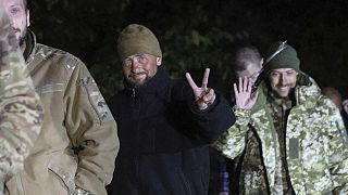 Ukrainian soldiers, who were released in a prisoner exchange between Russia and Ukraine, smile close to Chernihiv, 21 September 2022