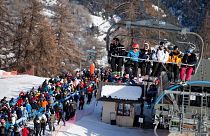 Skiers queue beside a lift in Serre Chevalier last year. Resorts had been hoping for an easier ride post-COVID restrictions.