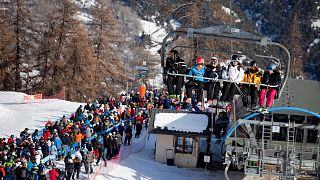 Skiers queue beside a lift in Serre Chevalier last year. Resorts had been hoping for an easier ride post-COVID restrictions.