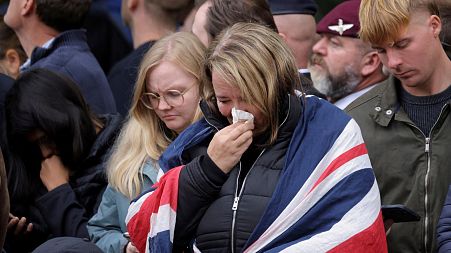 People get emotional as the procession starts on the day of the Queen Elizabeth II funeral