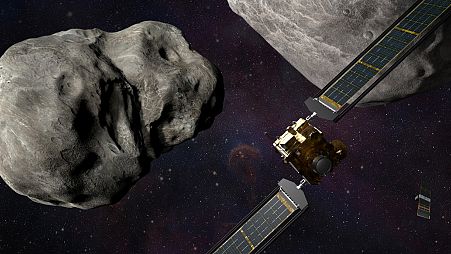 Illustration of NASA's DART probe, foreground right, and Italian Space Agency's (ASI) LICIACube, bottom right, at the Didymos system before impact with the asteroid Dimorphos.