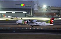 A TAP Air Portugal ATR 72-600 takes off from Lisbon airport.