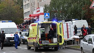 Police and paramedics work at the scene of a shooting at school No. 88 in Izhevsk, Russia, Monday, Sept. 26, 2022.