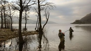 Fishermen cast their lines on the first day of the Scottish Salmon season on the River Tay in Perthshire, Scotland.