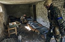 Ukrainian soldiers prepare ammunition in the recently retaken Kupiansk in the Kharkiv region, Ukraine, Thursday, Sept. 22, 2022