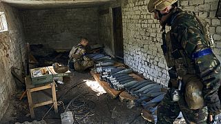 Ukrainian soldiers prepare ammunition in the recently retaken Kupiansk in the Kharkiv region, Ukraine, Thursday, Sept. 22, 2022