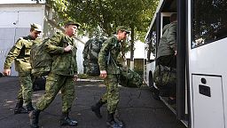 Russian recruits take a bus near a military recruitment center in Krasnodar, Russia, Sunday, Sept. 25, 2022