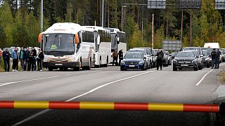 People travelling from Russia in cars and coaches queue to cross the border to Finland at the Vaalimaa border check point in Virolahti, Finland, Sunday, Sept. 25, 2022.