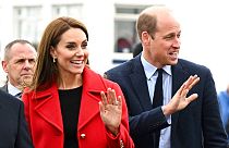 Britain's Kate, Princess of Wales, and Prince William wave during their visit to the RNLI Holyhead Lifeboat Station in Anglesey, north Wales,