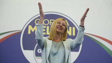 Giorgia Meloni cheered by supporters at her party's electoral headquarters in Rome, Monday 26 Sept 2022.