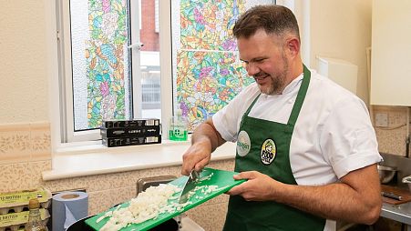 Kenny Tutt cooking at FoodCyle