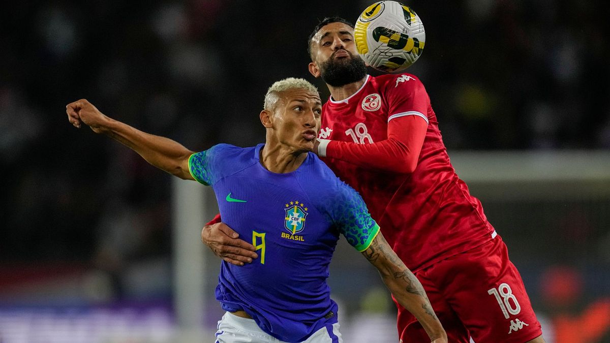 Tunisia's Ghaylen Chaaleli, right, duels for the ball with Brazil's Richarlison during the international friendly match between Brazil and Tunisia at the Parc des Princes