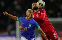 Tunisia's Ghaylen Chaaleli, right, duels for the ball with Brazil's Richarlison during the international friendly match between Brazil and Tunisia at the Parc des Princes