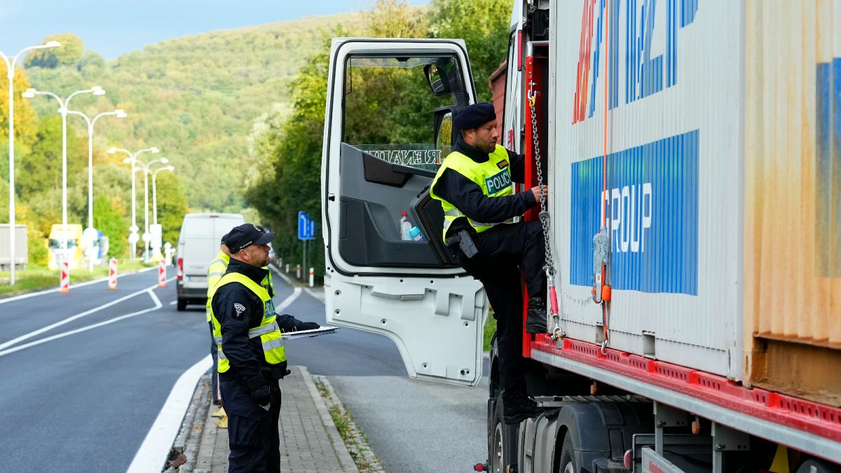 Czech policemen control a truck at the border with Slovakia in Stary Hrozenkov, Czech Republic, Thursday, Sept. 29, 2022. 