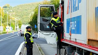 Czech policemen control a truck at the border with Slovakia in Stary Hrozenkov, Czech Republic, Thursday, Sept. 29, 2022.